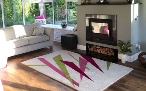 Hand tufted cream rug with colourful shapes
