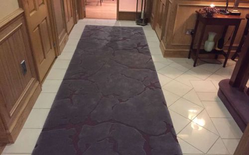Hand tufted cut and loop purple rug